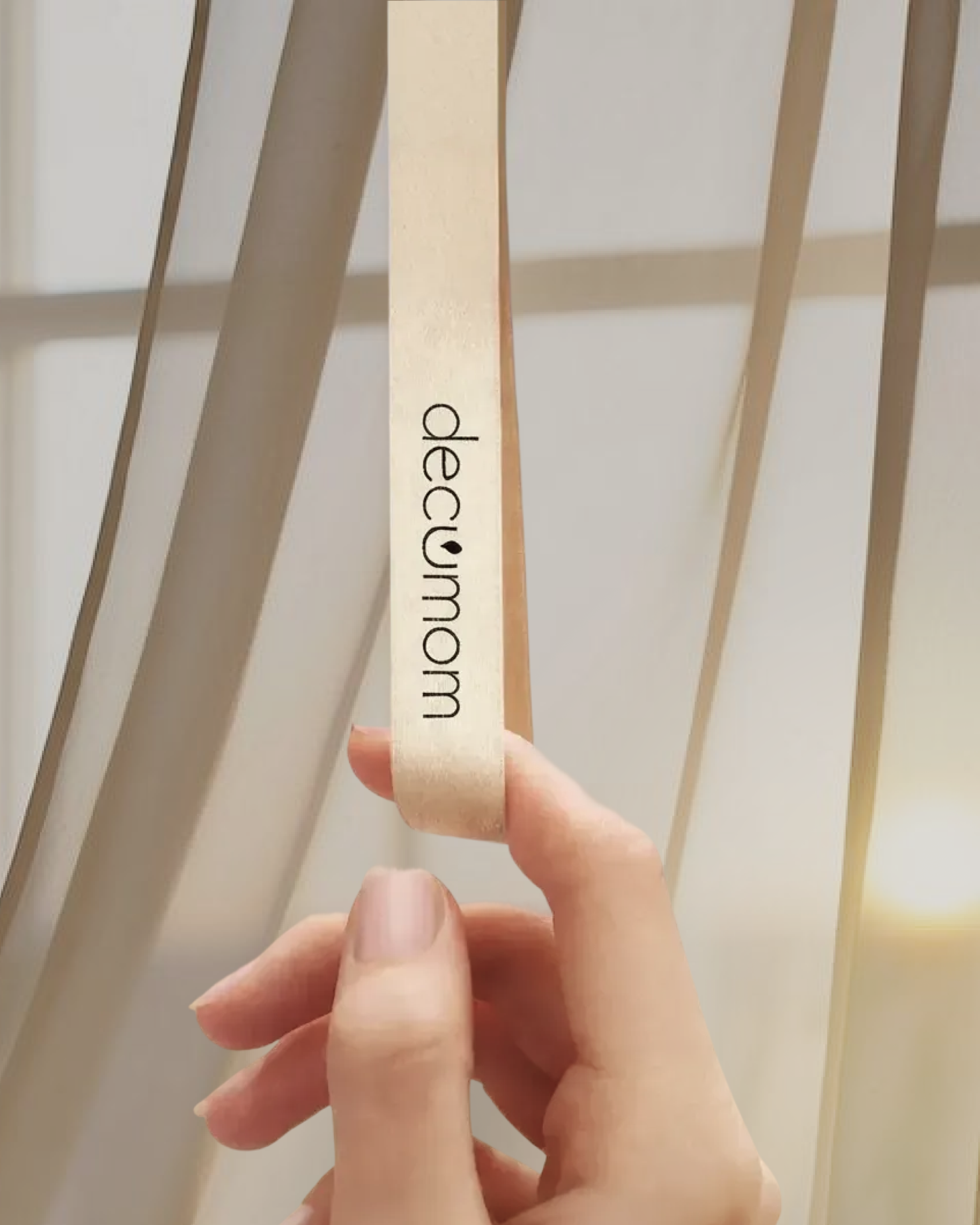 A render of three white cylindrical columns, against a warm creme background
